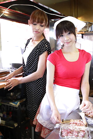 Hitomi Kanou and Akubi Yumemi have hairy cunts rubbed while cooking.