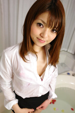 Kimoko Tsuji gets many toys on her body and in hairy pussy in bathtub.